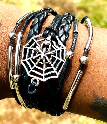A multi-strand leather bracelet adorned with cobweb decorations sounds like a unique and edgy accessory