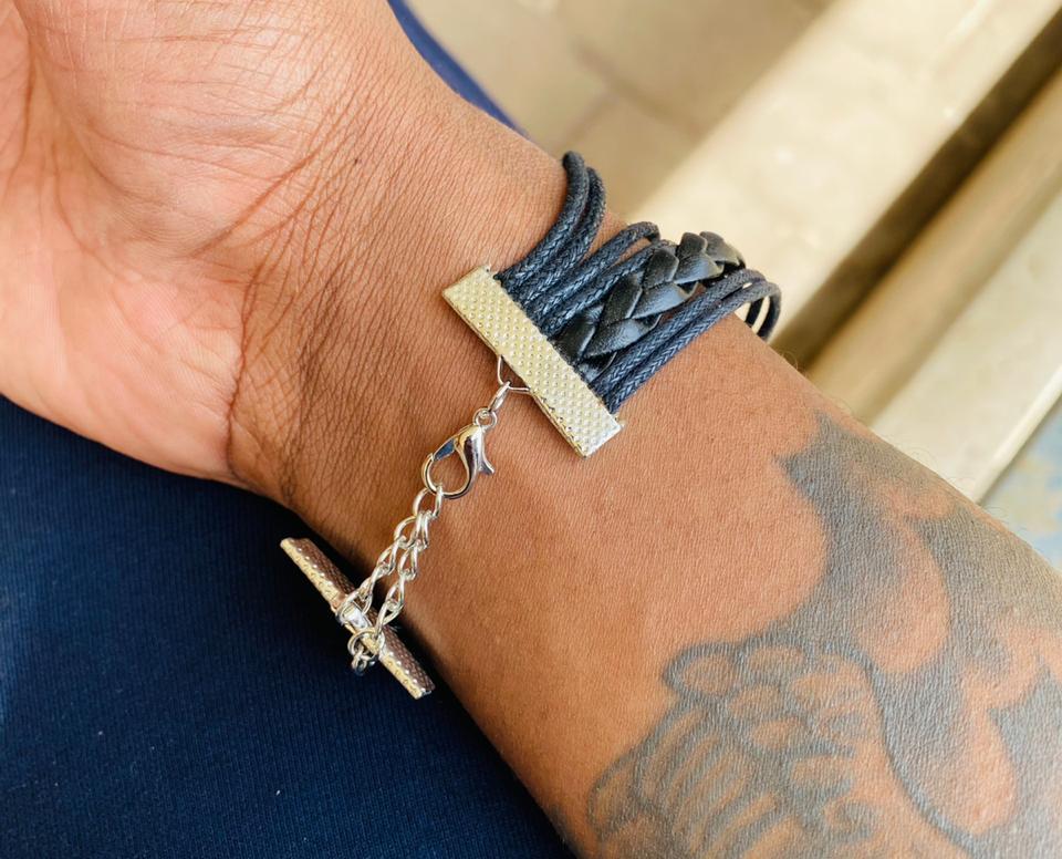 A multi-strand leather bracelet adorned with cobweb decorations sounds like a unique and edgy accessory