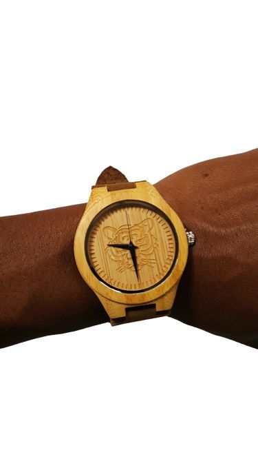 A handmade bamboo watch with leather straps is a unique and eco-friendly timepiece that combines natural materials with classic design elements