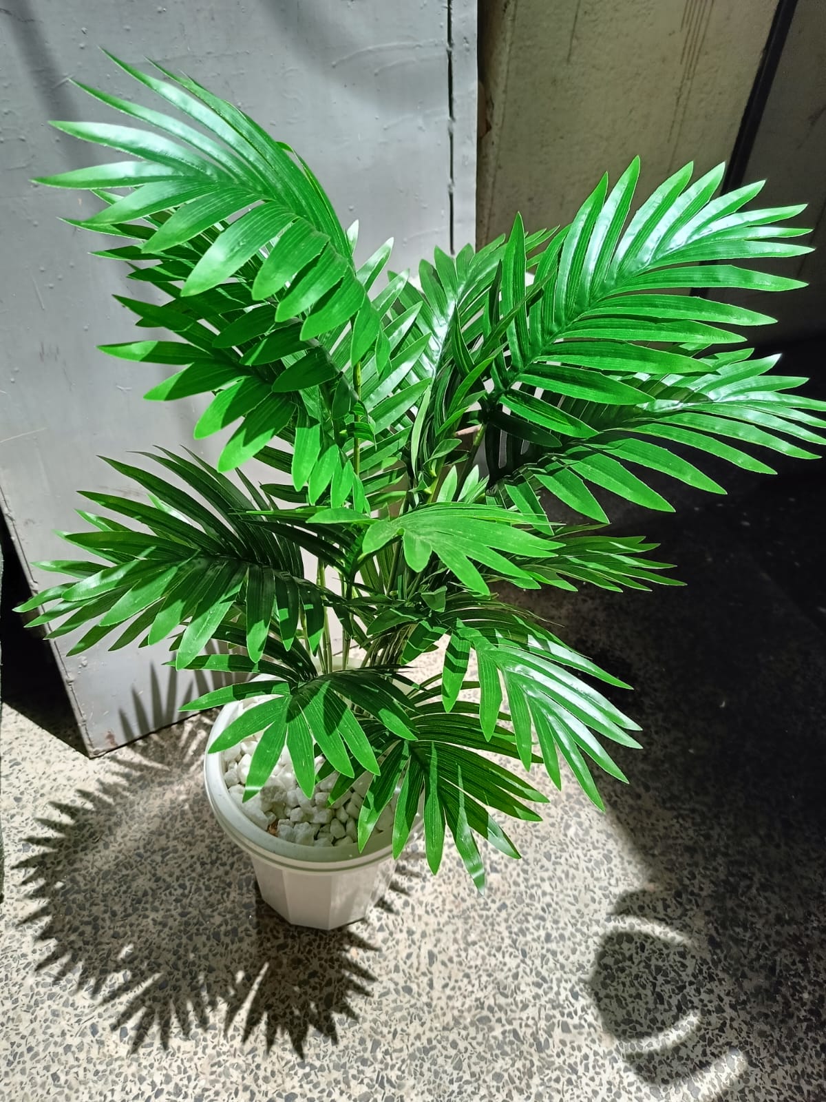 Artificial Palm Flower with Decor stones and Vase | add a luxurious touch to your interior setting and the same time, it is a zero maintenance.