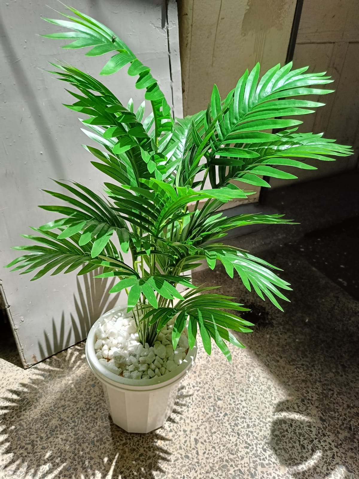 Artificial Palm Flower with Decor stones and Vase | add a luxurious touch to your interior setting and the same time, it is a zero maintenance.