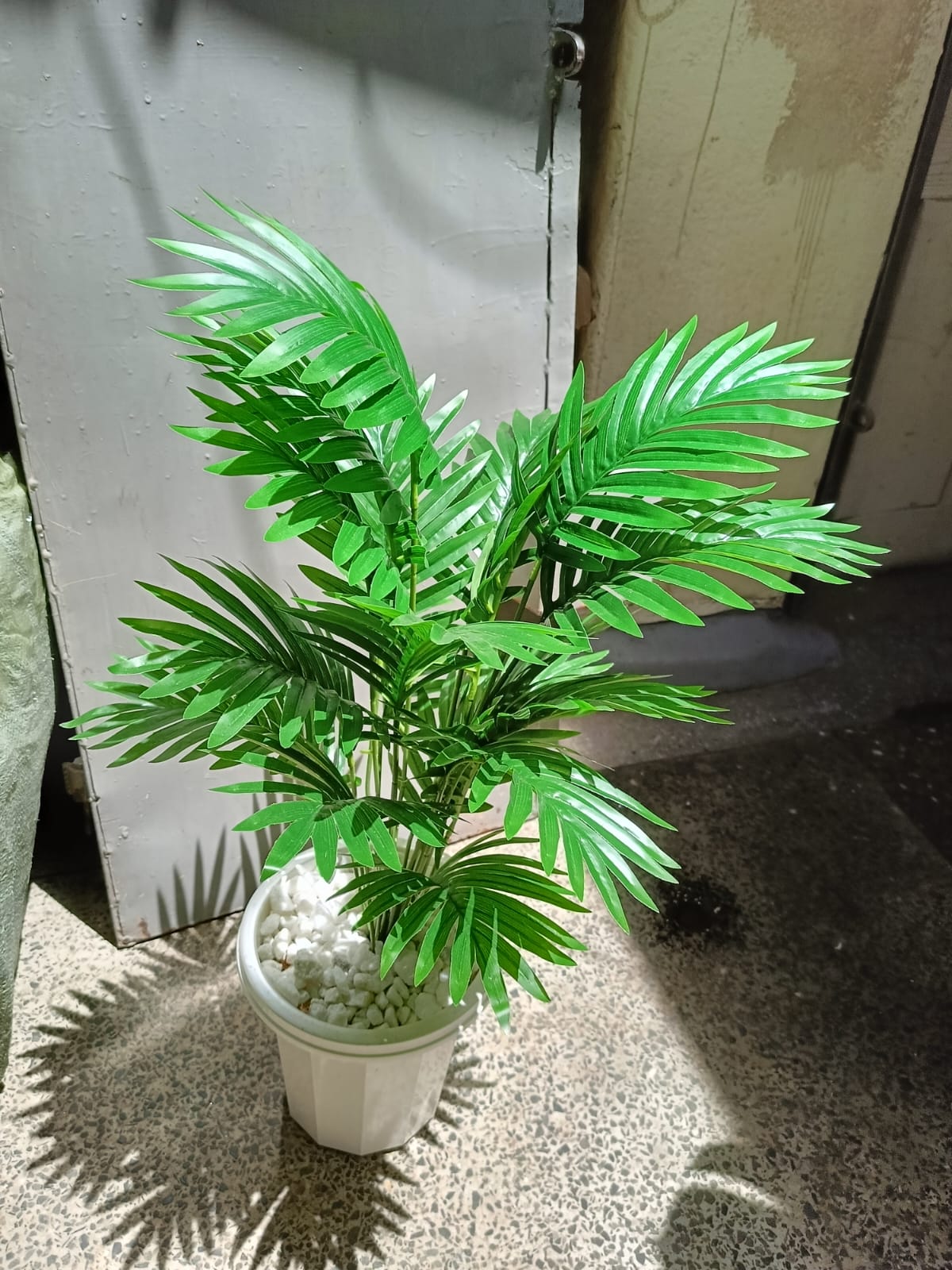 Artificial Palm Flower with Decor stones and Vase | add a luxurious touch to your interior setting and the same time, it is a zero maintenance.
