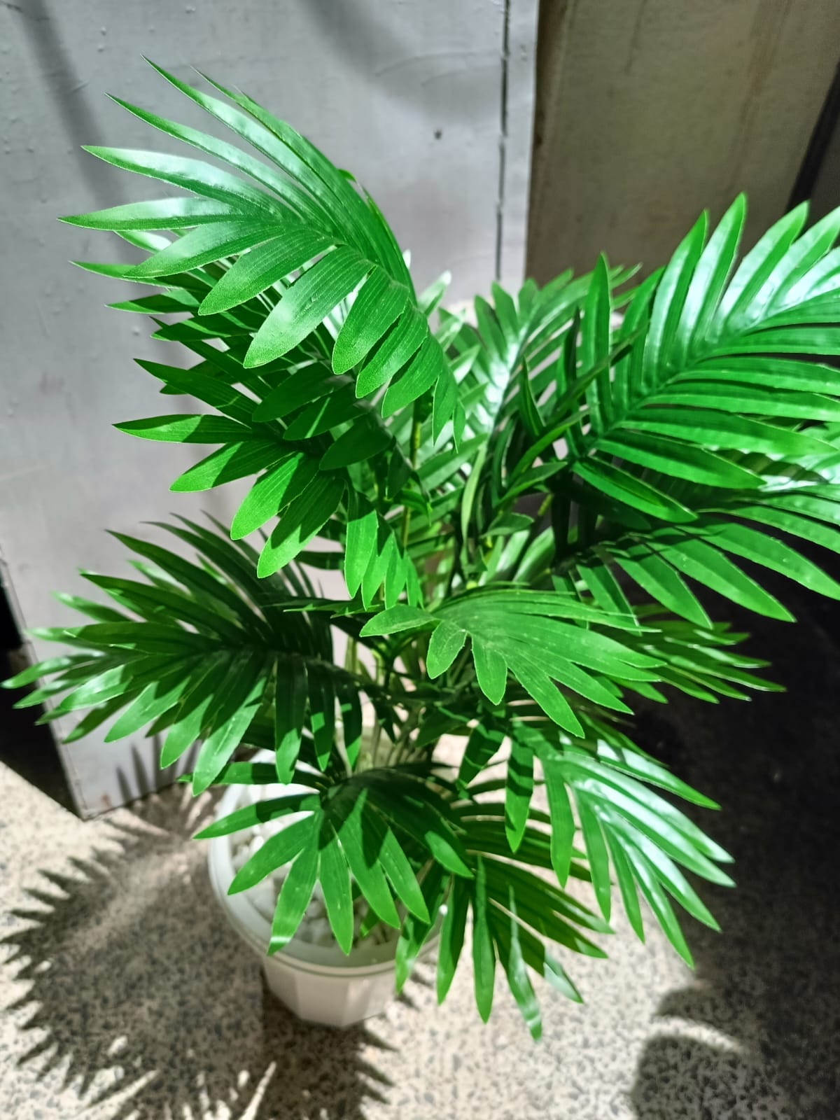 Artificial Palm Flower with Decor stones and Vase | add a luxurious touch to your interior setting and the same time, it is a zero maintenance.