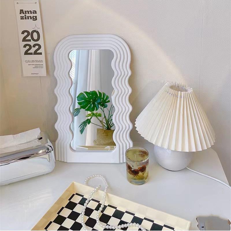 Tabletop wavy classy or wall-mounted decor mirrors are available in gold, black, and white.