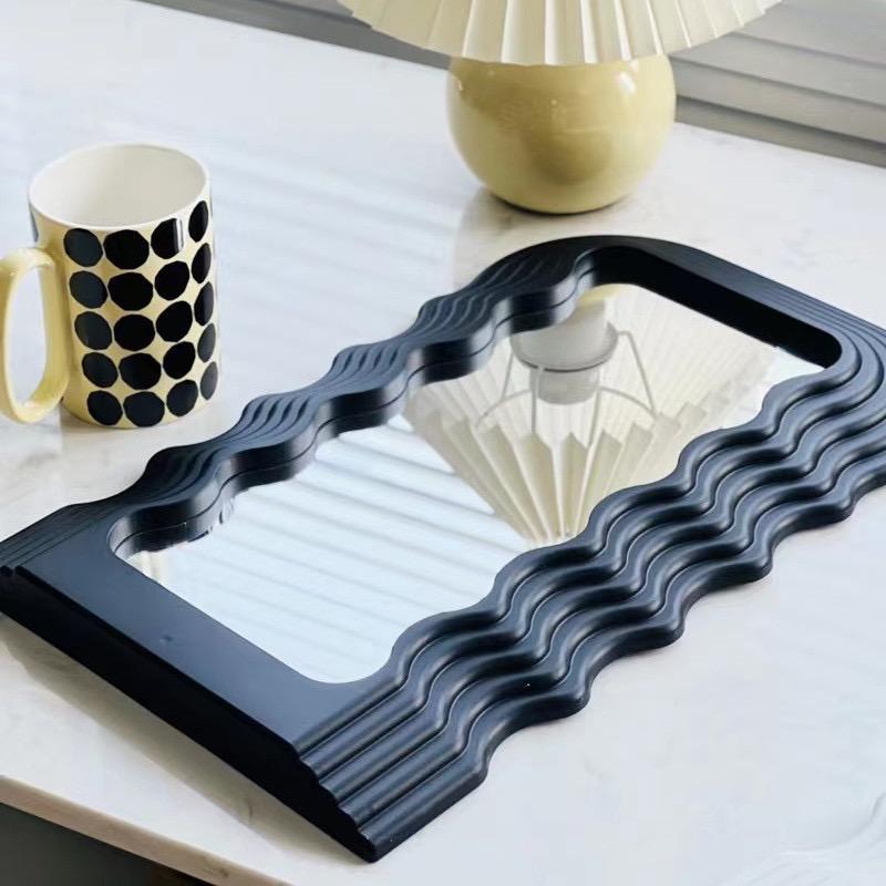 Tabletop wavy classy or wall-mounted decor mirrors are available in gold, black, and white.