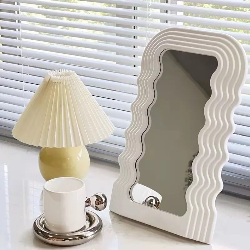Tabletop wavy classy or wall-mounted decor mirrors are available in gold, black, and white.