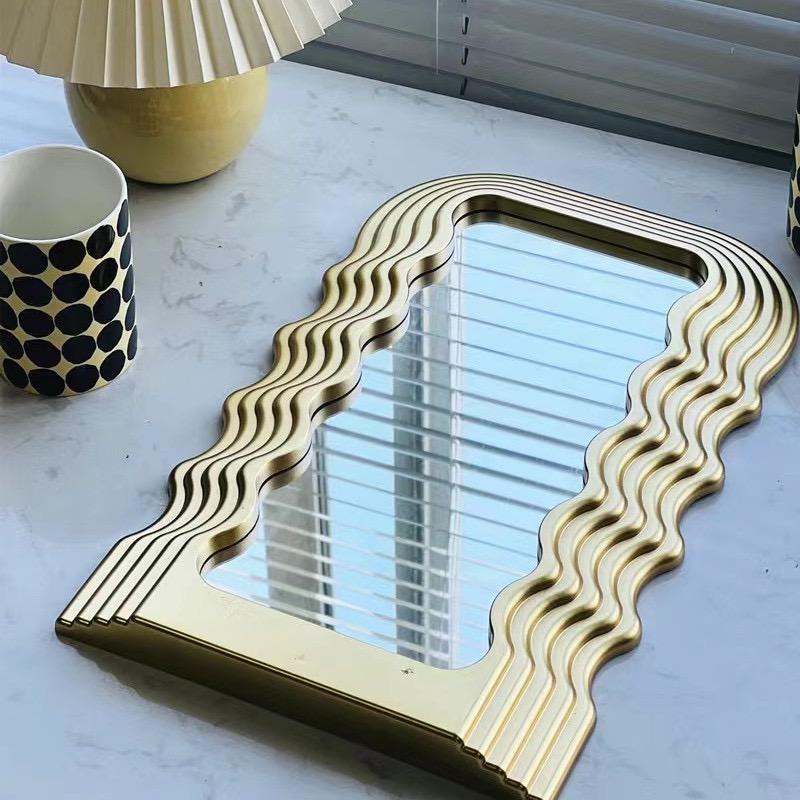 Tabletop wavy classy or wall-mounted decor mirrors are available in gold, black, and white.