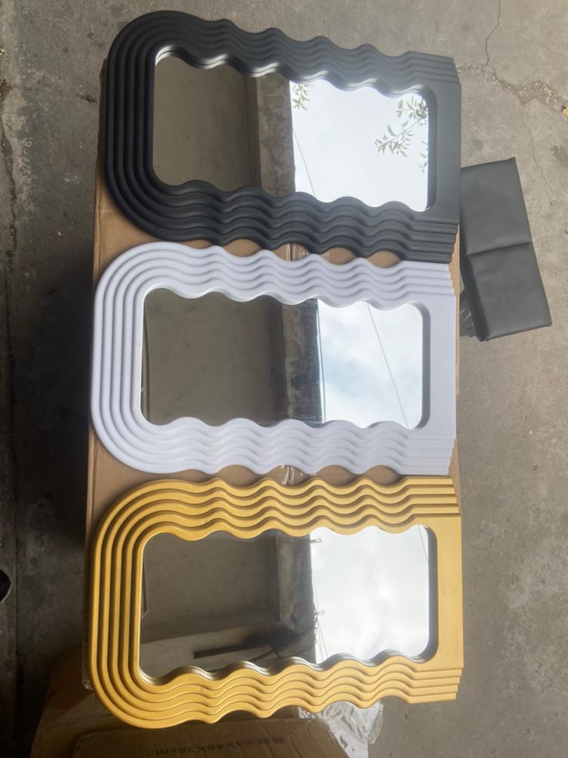 Tabletop wavy classy or wall-mounted decor mirrors are available in gold, black, and white.