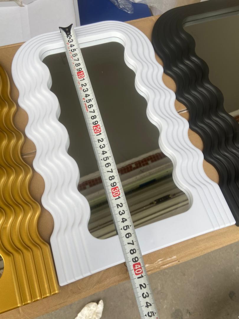 Tabletop wavy classy or wall-mounted decor mirrors are available in gold, black, and white.