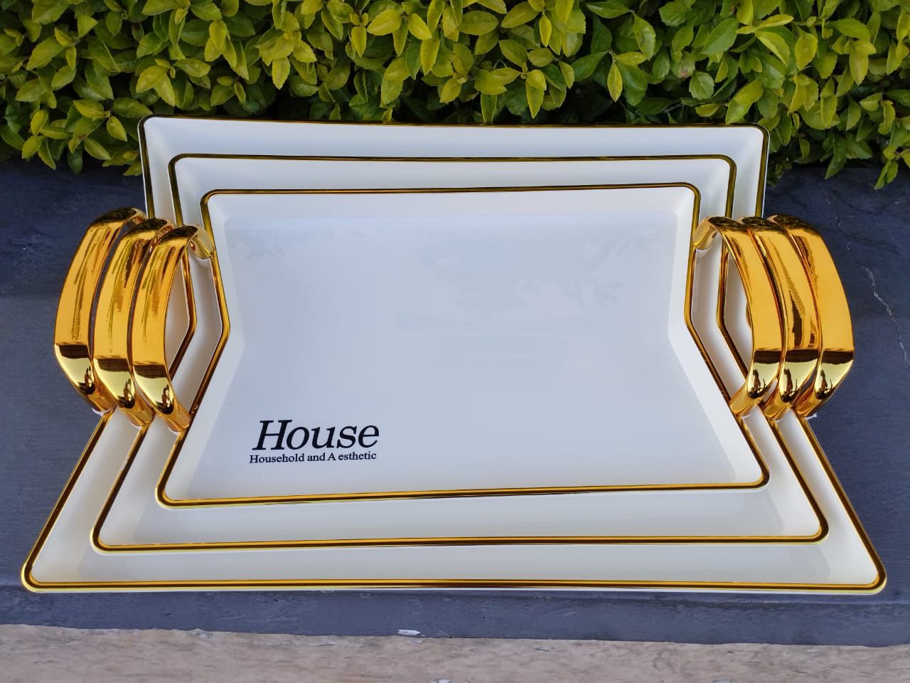 Set of 3 Golden Trays . High quality & different sizes sliver rectangular decorative serving tray set with designer golden color handle. Ideal for personal use, or gifting purposes on special occasion