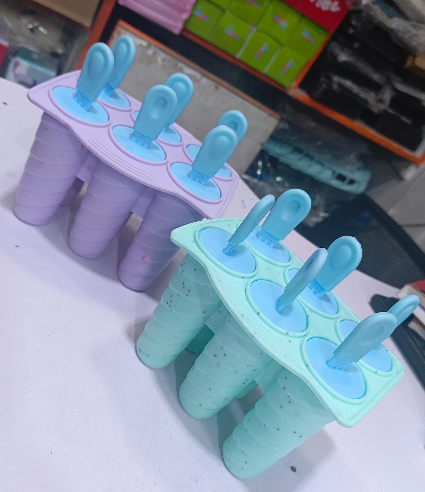 6-Slot Silicon Popsicle ~ Reusable Design with Drip-Guards on the Sticks to Prevent Mess.