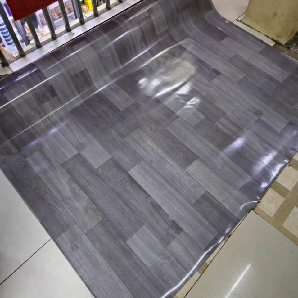 deep ash‑grey woodgrain pattern with subtle streaks of charcoal & silver undertone wood effect waterproof PVC vinyl flooring carpet Mkeka Wa Mbao Wood Effect Cushion vinyl flooring Wood Finish Carpet