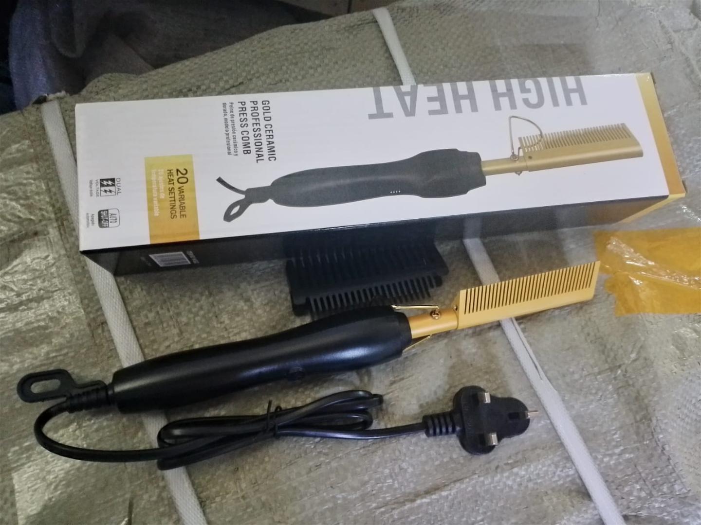 professional electric hot comb, a versatile styling tool used for straightening and smoothing hair.