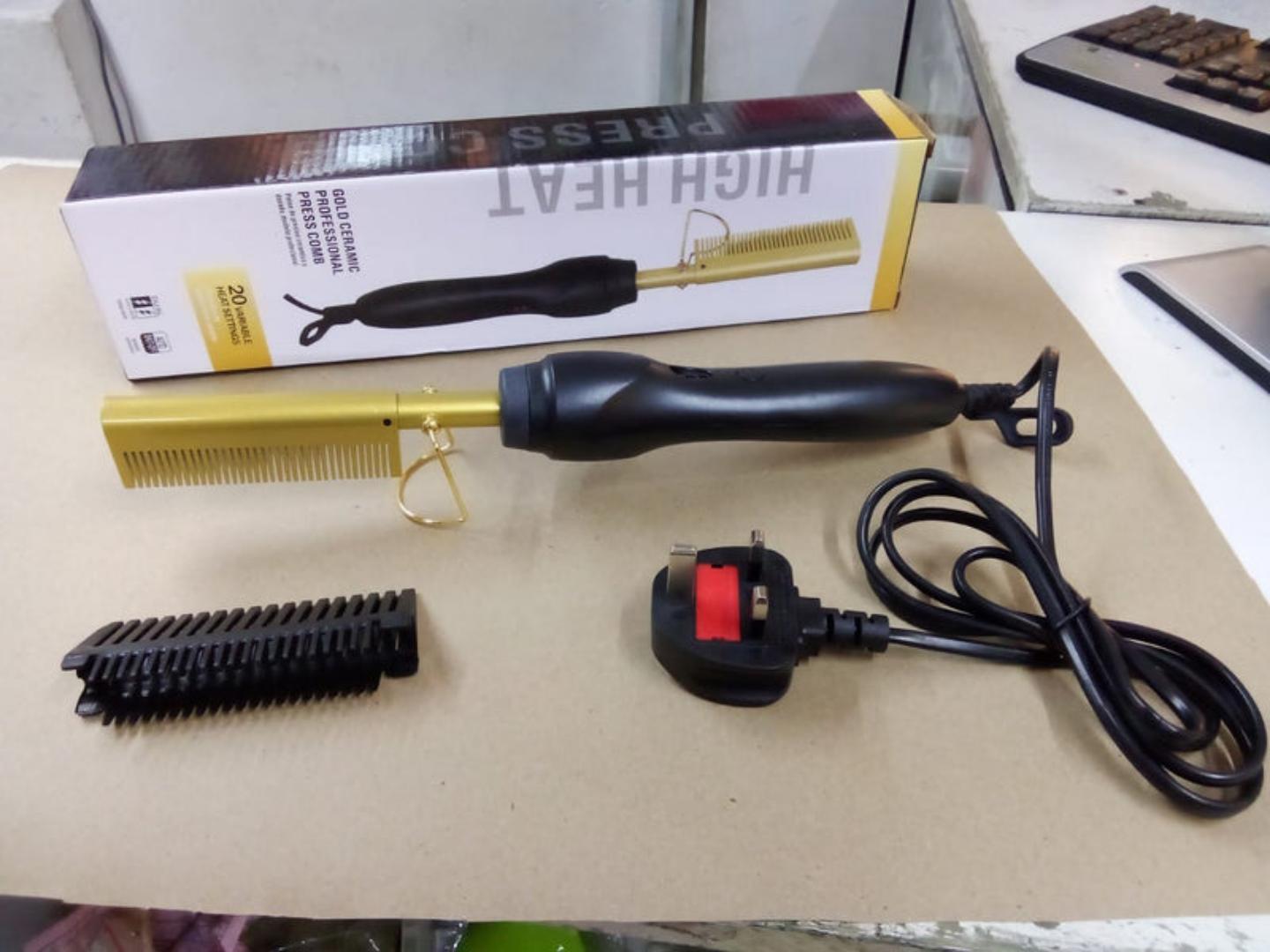 professional electric hot comb, a versatile styling tool used for straightening and smoothing hair.