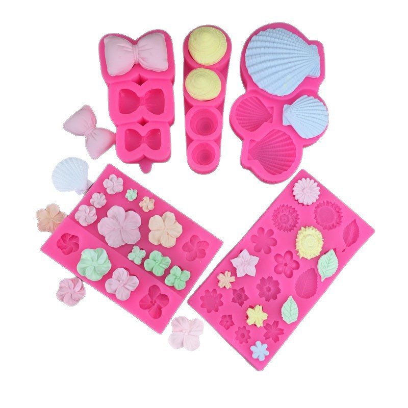 Silicone molds for pillows, bows, conch shells, frangipani flowers, and herbs; fondant cakes; chocolate decorations and accessories molds.
