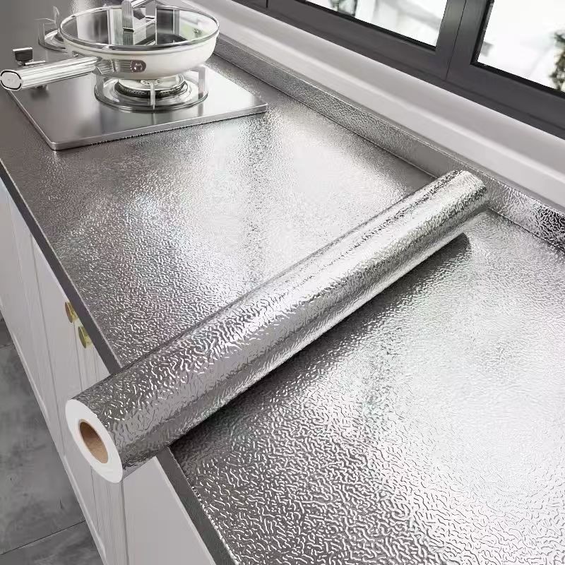 Waterproof, oil-proof, and moisture-proof stickers for cabinets, drawer liners, stovetop aluminum foil, tin foil, and self-adhesive wallpaper.