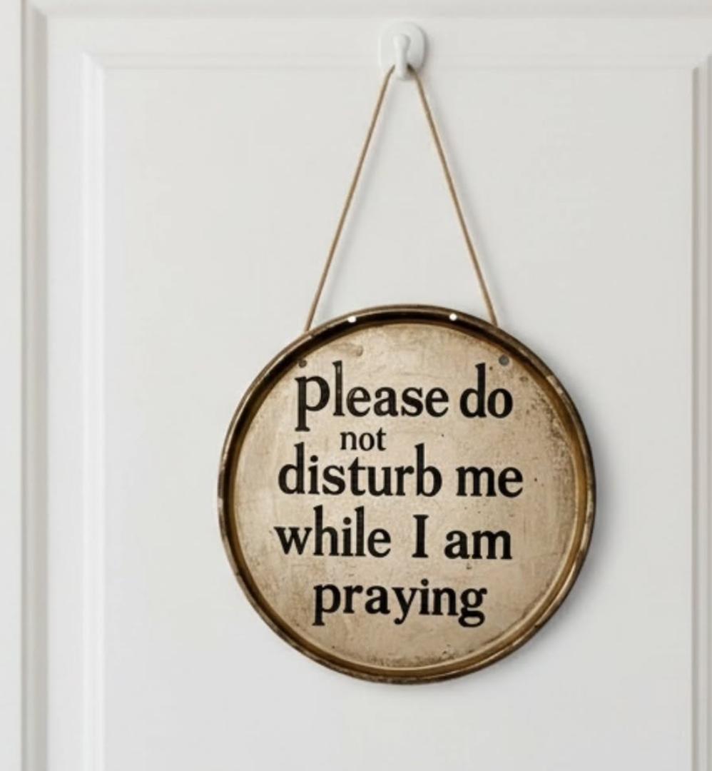 2D ROUND HOME DECOR VINTAGE HOME SIGN. This vintage round metal sign brings cheeky farmhouse charm to any space with its cream background, navy blue embossed text, and distressed rusty edges. It reads