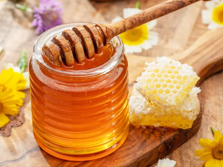 Honey is a sweet, viscous food substance made by honey bees from the nectar of flowers or plant secretions. It is primarily composed of sugars like fructose and glucose, with low water content .