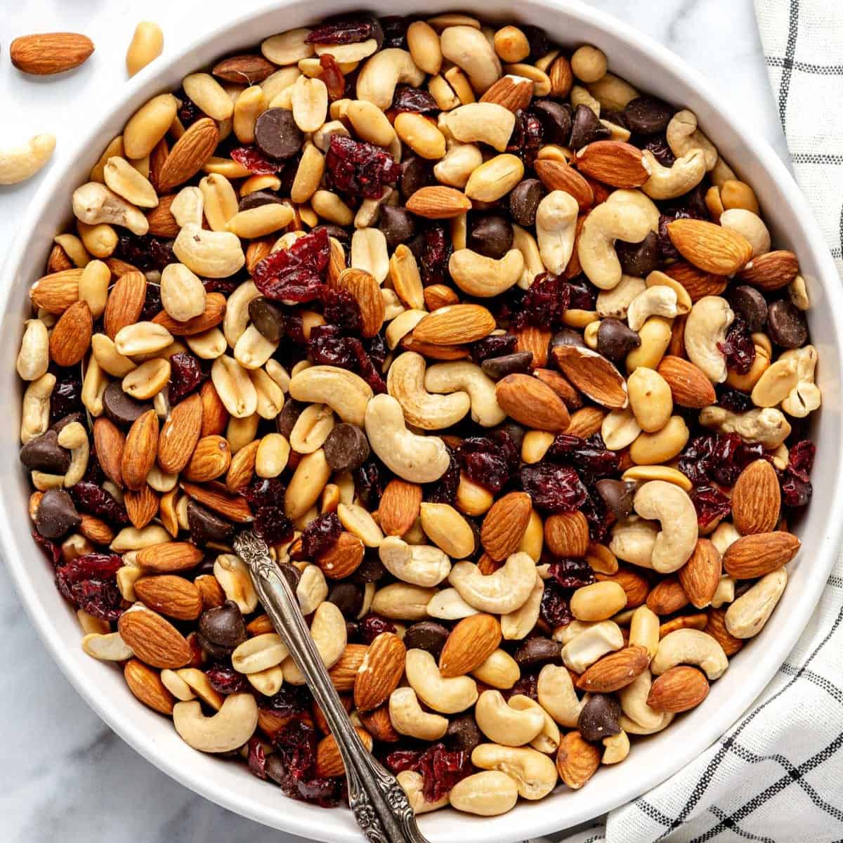 Mixed nuts are a versatile snack that typically combines variety in flavor, texture, and nutrition. Most commercial blends include a mix of peanuts, almonds, cashews, walnuts, and brazil nuts.