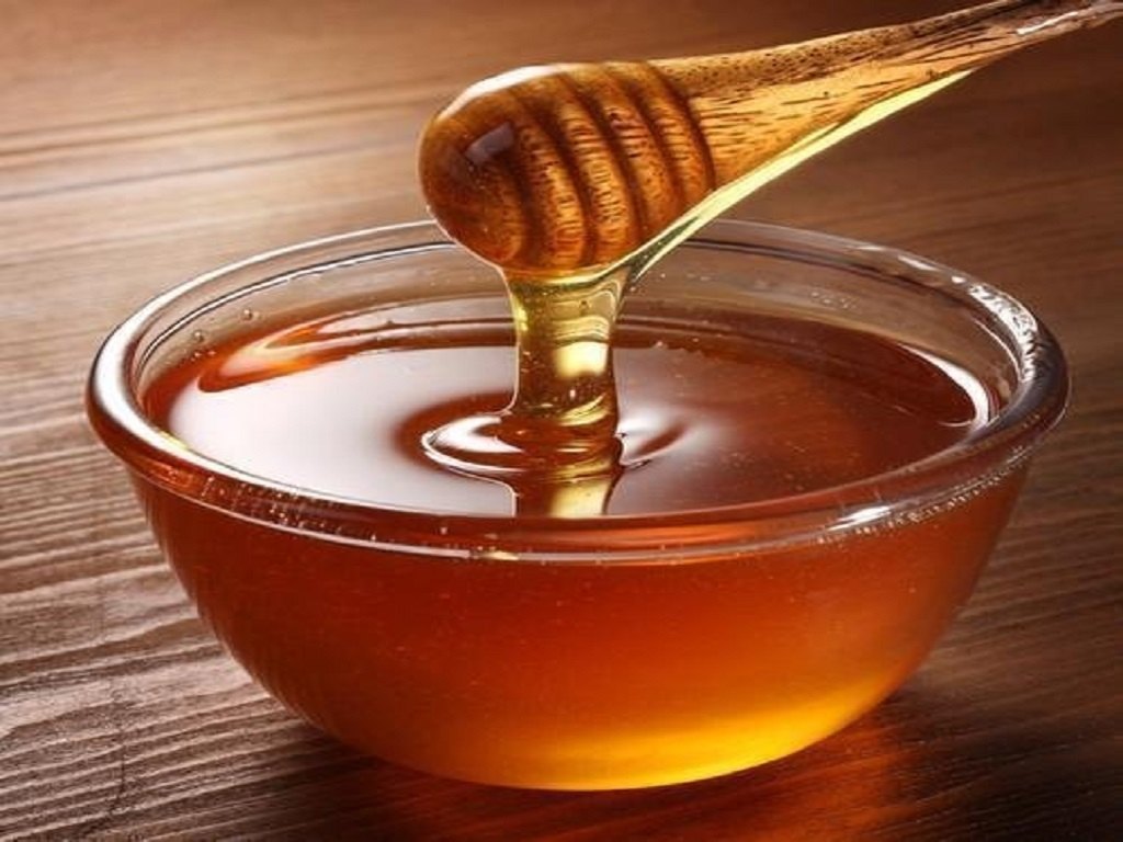 Honey is a sweet, viscous food substance made by honey bees from the nectar of flowers or plant secretions. It is primarily composed of sugars like fructose and glucose, with low water content .
