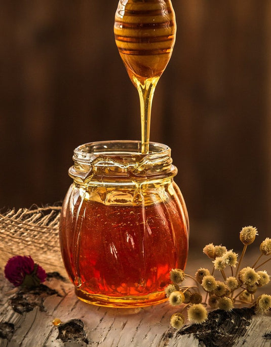 Honey is a sweet, viscous food substance made by honey bees from the nectar of flowers or plant secretions. It is primarily composed of sugars like fructose and glucose, with low water content .