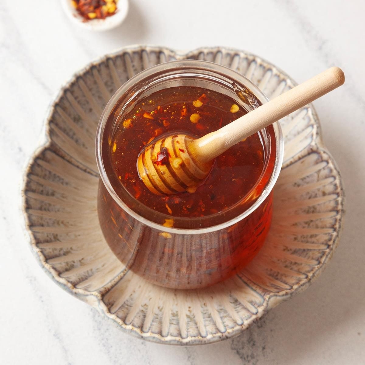 Honey is a sweet, viscous food substance made by honey bees from the nectar of flowers or plant secretions. It is primarily composed of sugars like fructose and glucose, with low water content .