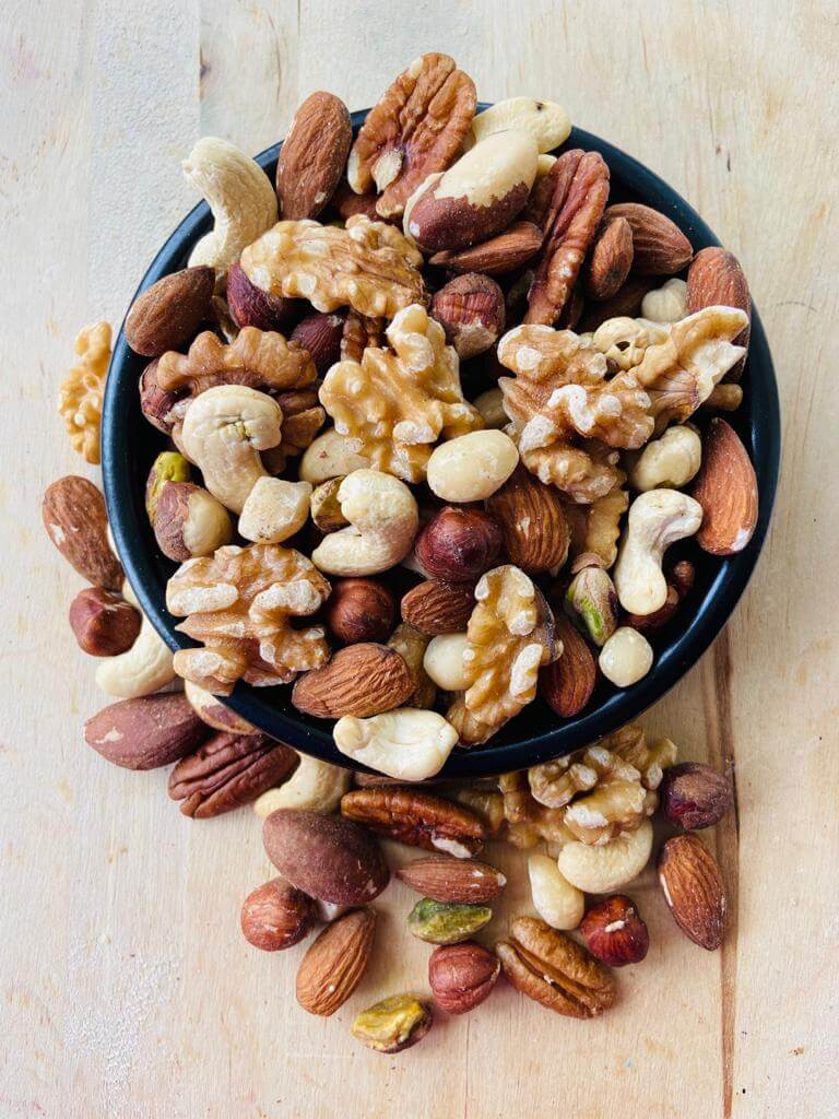 Mixed nuts are a versatile snack that typically combines variety in flavor, texture, and nutrition. Most commercial blends include a mix of peanuts, almonds, cashews, walnuts, and brazil nuts.
