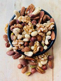 Mixed nuts are a versatile snack that typically combines variety in flavor, texture, and nutrition. Most commercial blends include a mix of peanuts, almonds, cashews, walnuts, and brazil nuts.