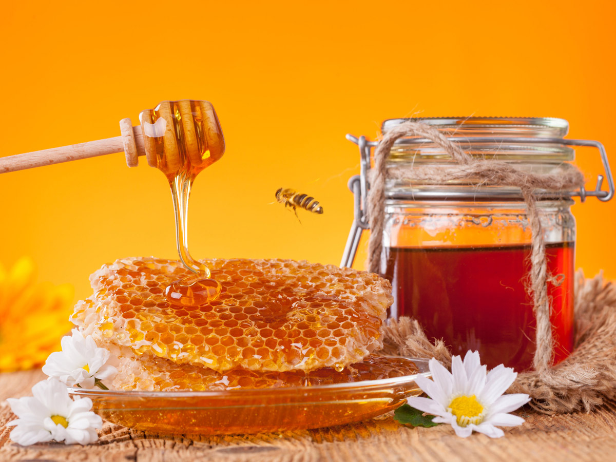 Honey is a sweet, viscous food substance made by honey bees from the nectar of flowers or plant secretions. It is primarily composed of sugars like fructose and glucose, with low water content .