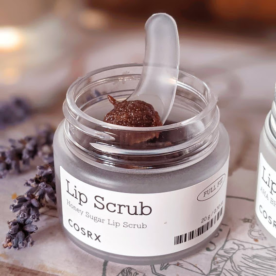 COSRX Full Fit Honey Sugar Lip Scrub containing sucrose for exfoliation and honey extract for moisturizing.