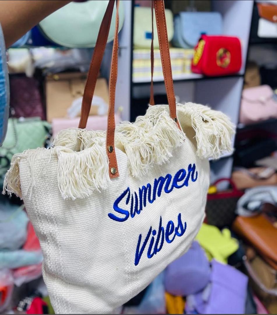SUMMER BAGS FOR CLASSIC WOMEN✅ *Summer Vibes Tote Bag - For Sale*

Olive green canvas tote with tassel detail + leatherette handles. "Summer Vibes" embroidered print. Big enough for beach gear, grocer