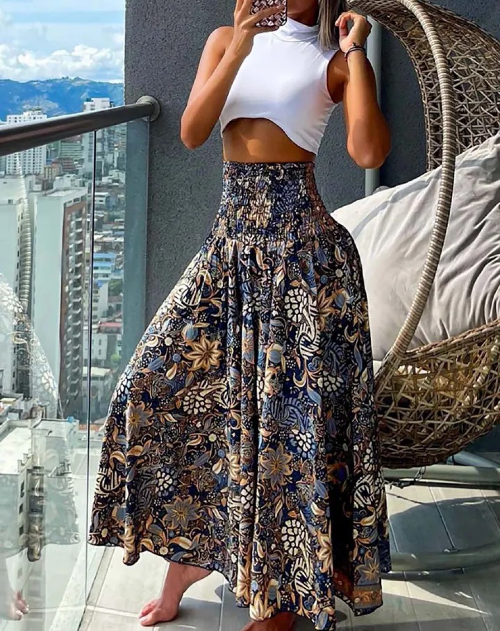 New European and American women's clothing,  fashionable and versatile Bohemian printed elastic waist mid length skirt, casual loose holiday floral skirt, high waist half skirt, slim A-line skirt,