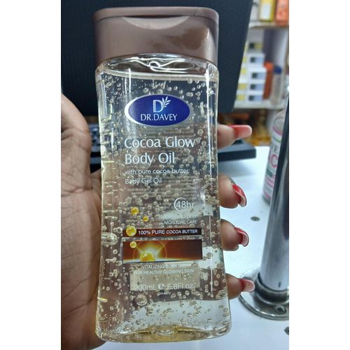 Dr. Davey Cocoa Glow Body Oil (200ml / 6.8 Fl. Oz.), a moisturizing body gel oil formulated with pure cocoa butter designed for up to 48 hours of moisture care and a natural glow