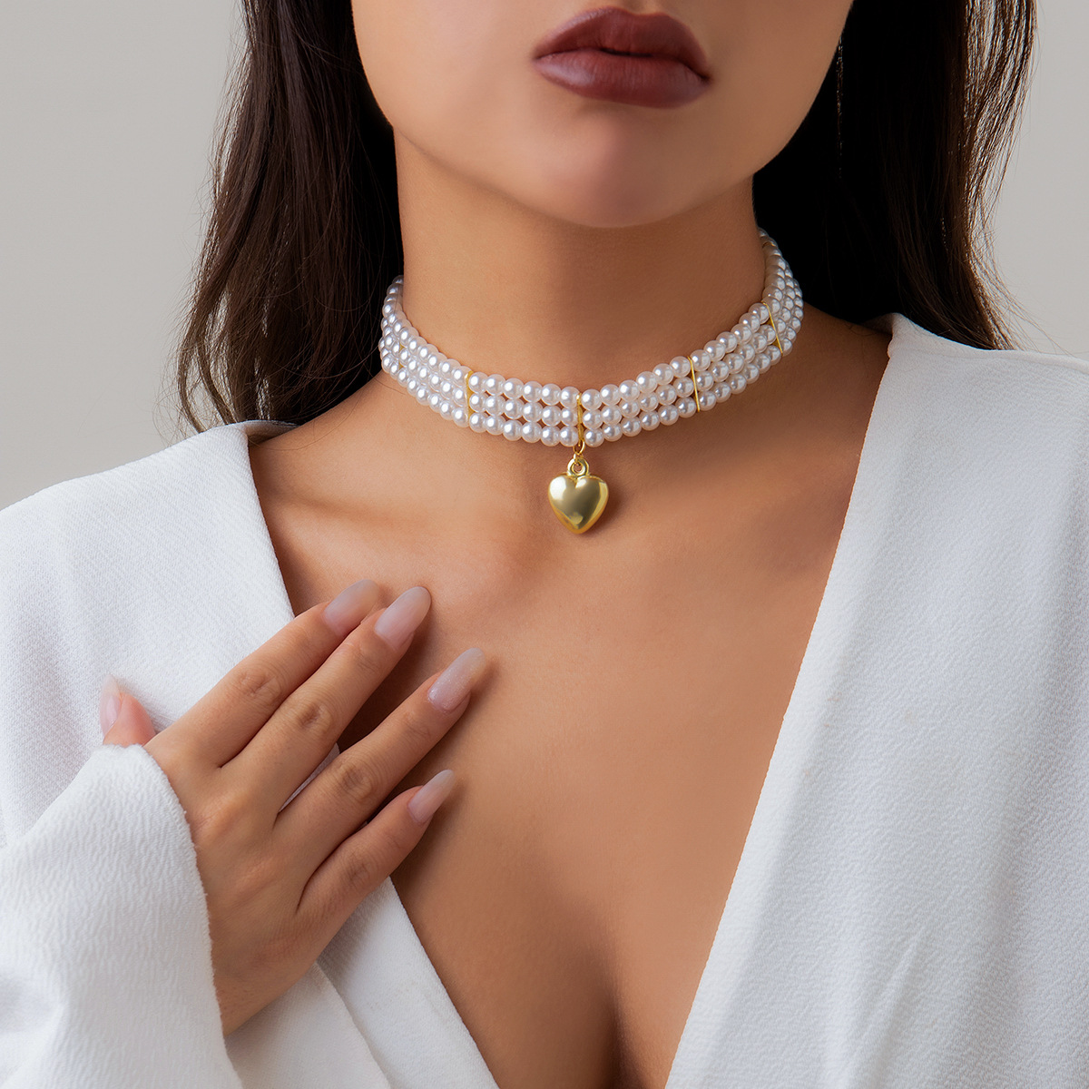 Minimalist French-style faux pearl choker necklace with a sweet yet edgy, niche heart-shaped pendant