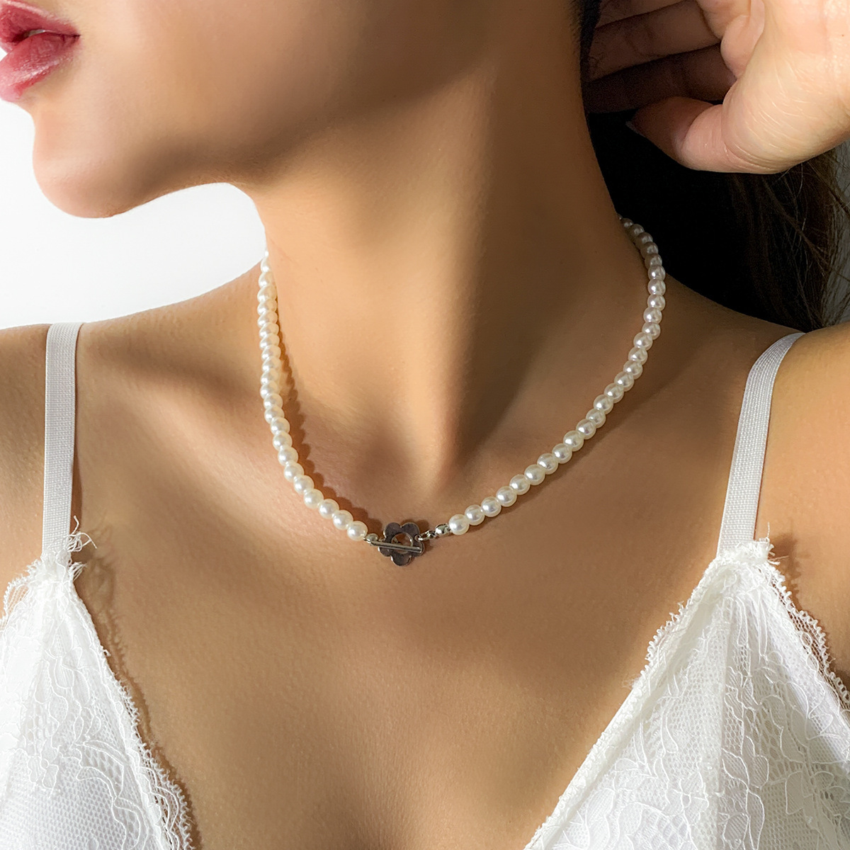 Minimalist French-style faux pearl choker necklace with a sweet yet edgy, niche heart-shaped pendant