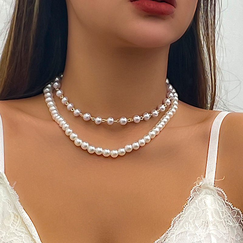 Minimalist French-style faux pearl choker necklace with a sweet yet edgy, niche heart-shaped pendant