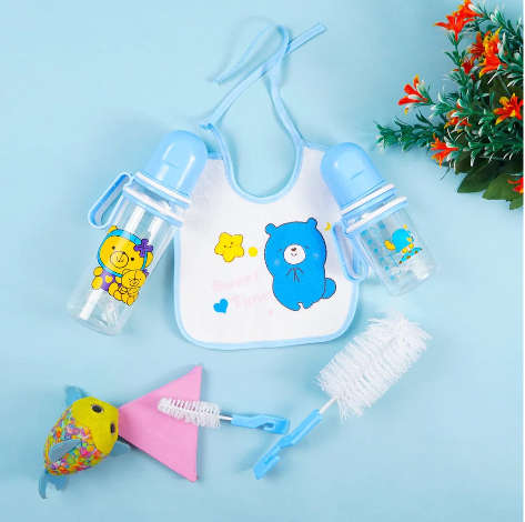 7pcs Baby Feeding Set  A full feeding kit that includes two feeding bottles, a bib, bottle cleaning brushes, ear buds, and a baby pacifier. Made with baby-friendly materials and convenient accessories
