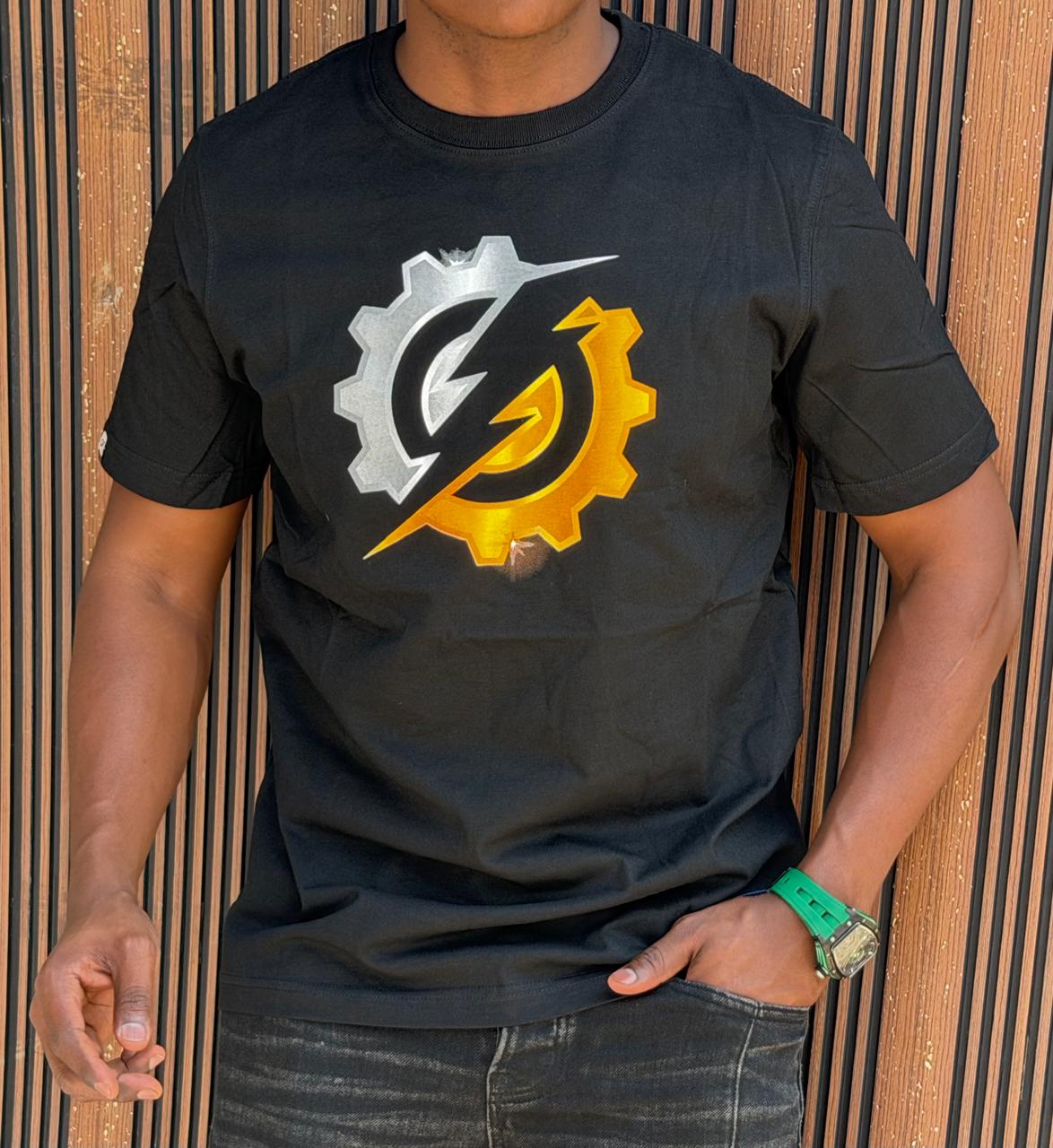 LATEST New Arrival Unisex Fashionable Trendy  Cotton Classic Classy Graphic Cotton T-Shirt with a split-color gear and lightning bolt emblem across the chest.
