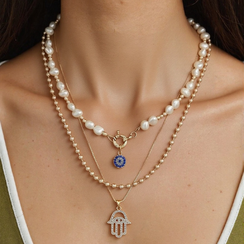 Cross border hot selling 2025 new European and American exaggerated diamond inlaid multi-layer necklace women's pearl eye pendant chain set