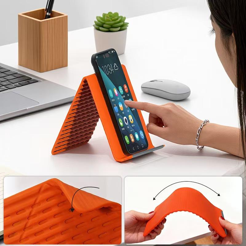 New Arrivals Multi-Functional Silicone Phone Stand, Adjustable Multi-Angle Holder, Non-Slip & Bendable for All Phones & Tablets Black/Orange