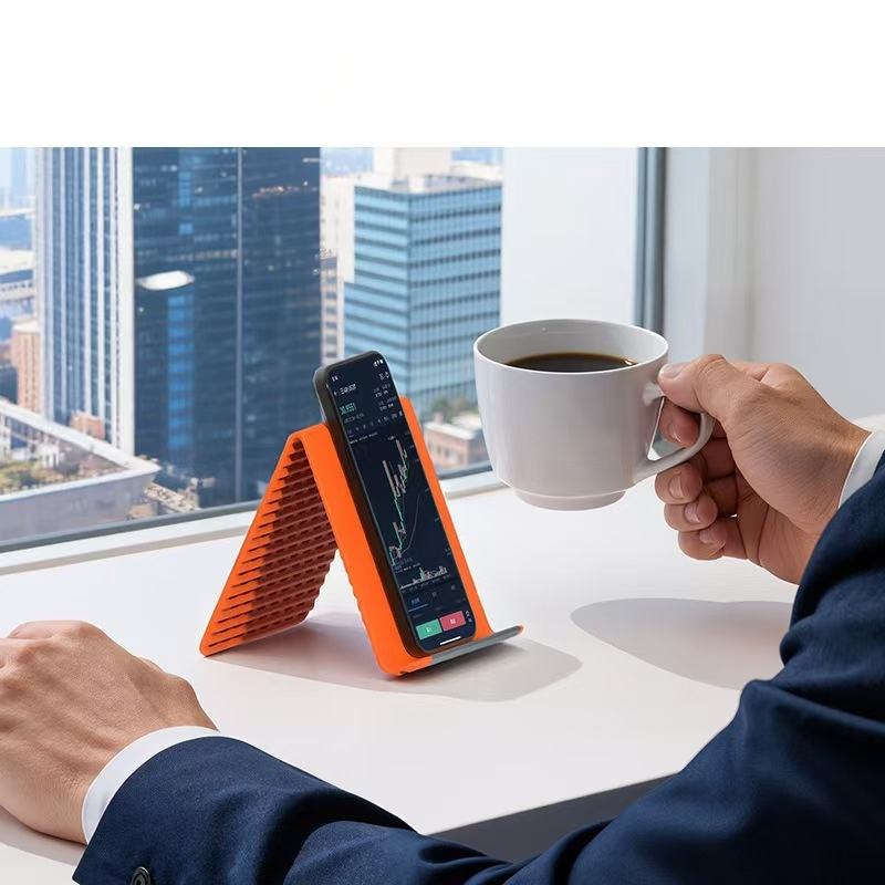 New Arrivals Multi-Functional Silicone Phone Stand, Adjustable Multi-Angle Holder, Non-Slip & Bendable for All Phones & Tablets Black/Orange