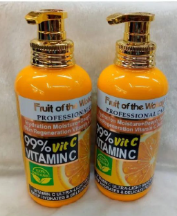500ml bottle of Fruit of the Wokali Professional Care 99% Vitamin C Body Lotion with a gold-colored pump dispenser.