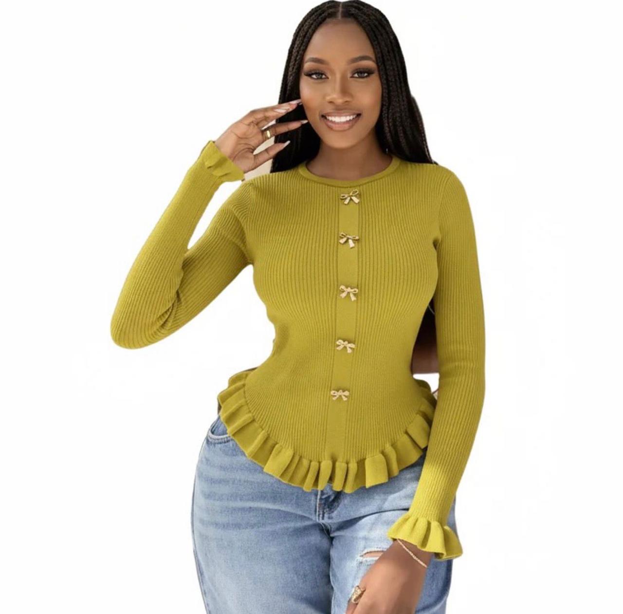 A knitted cardigan or sweater top characterized by its prominent silver/gold-tone heart-shaped buttons and has a slightly cropped length with long, voluminous balloon sleeves that end in ribbed cuffs.