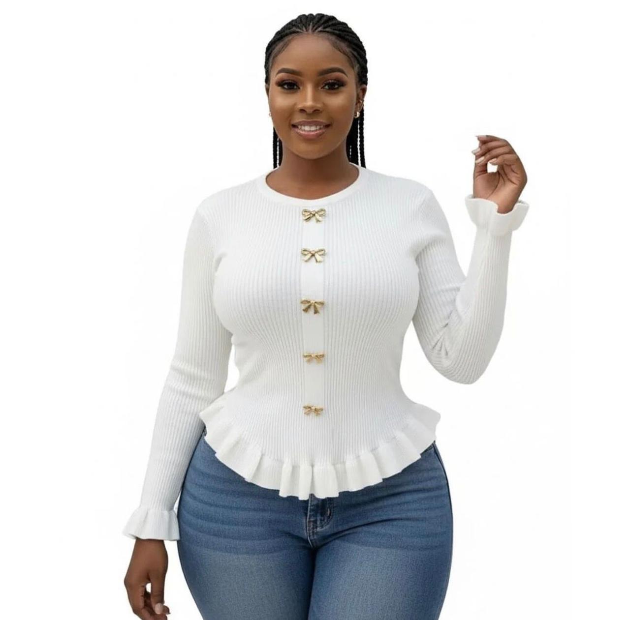 A knitted cardigan or sweater top characterized by its prominent silver/gold-tone heart-shaped buttons and has a slightly cropped length with long, voluminous balloon sleeves that end in ribbed cuffs.