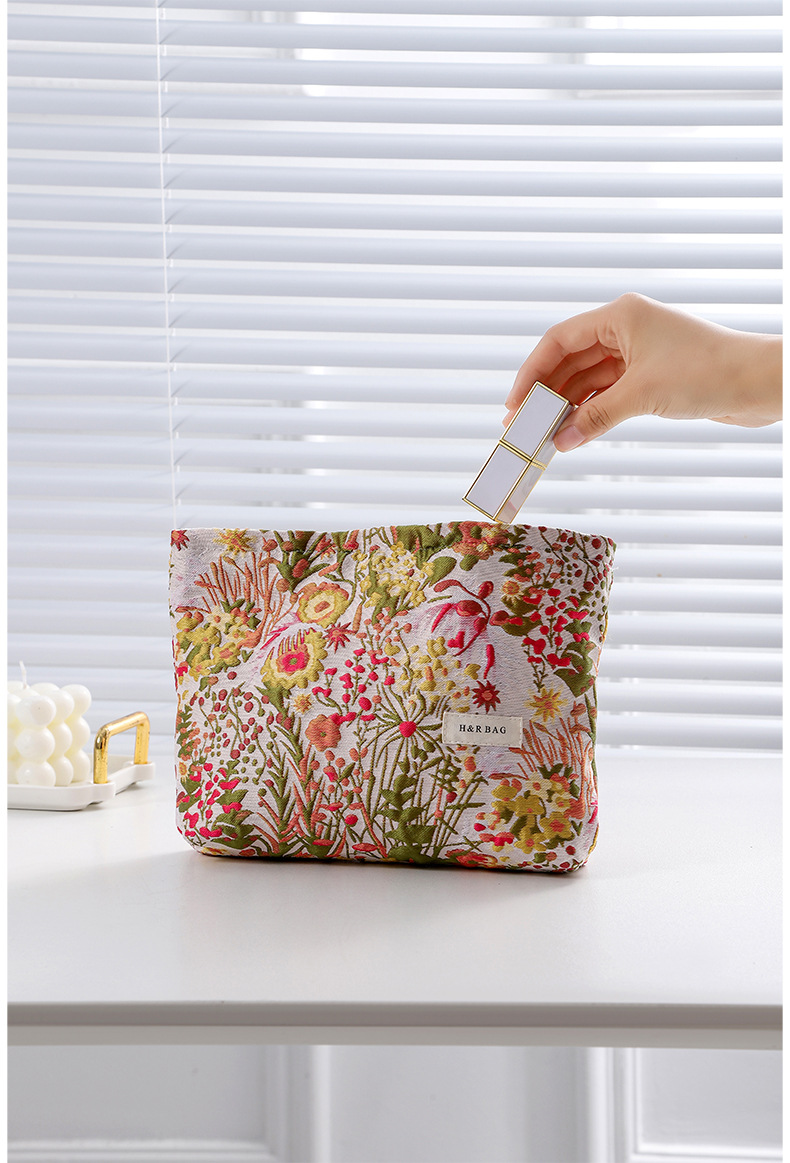 This is a small and unique retro floral jacquard woven cosmetic portable storage bag with a high appearance level. It can be carried around as a toiletry bag or a clutch.