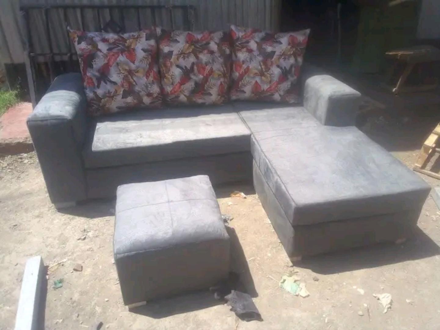 (offer) new classic l seat five seater sofa set. stylish for medium rooms . it is fitted with high quality cushions and fibre for pillows. it has a foot rest