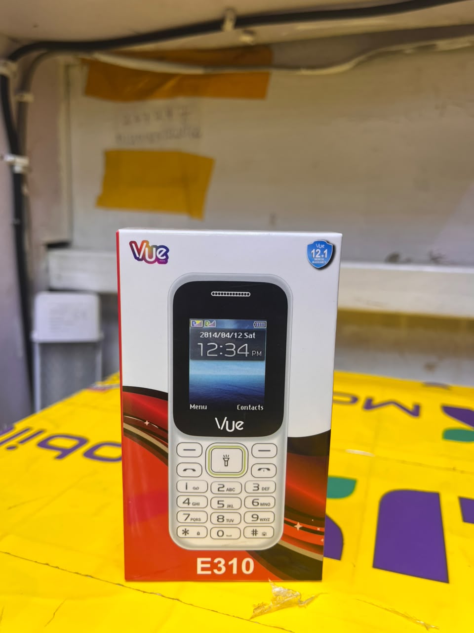 VUE E310 IS AN AFFORDABLE DUAL-SIM FEATURE PHONE FEATURING A 1.77-INCH SCREEN, A WIRELESS FM RADIO, AND A BUILT-IN TORCH LIGHT (OFTEN STYLED LOCALLY AS A "MULIKA MWIZI" OR "KABAMBE" PHONE