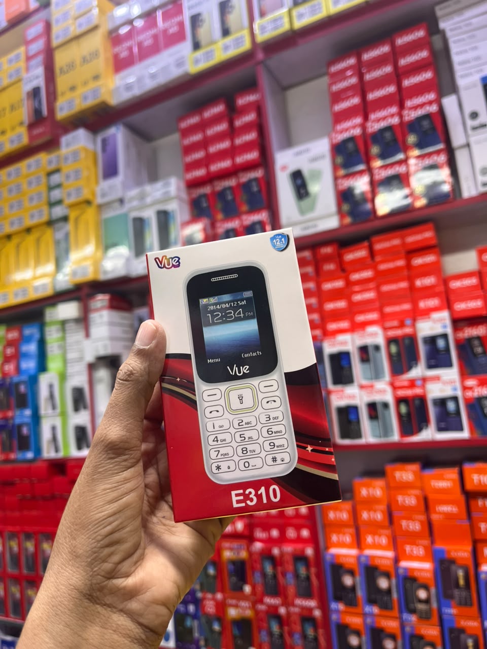 VUE E310 IS AN AFFORDABLE DUAL-SIM FEATURE PHONE FEATURING A 1.77-INCH SCREEN, A WIRELESS FM RADIO, AND A BUILT-IN TORCH LIGHT (OFTEN STYLED LOCALLY AS A "MULIKA MWIZI" OR "KABAMBE" PHONE
