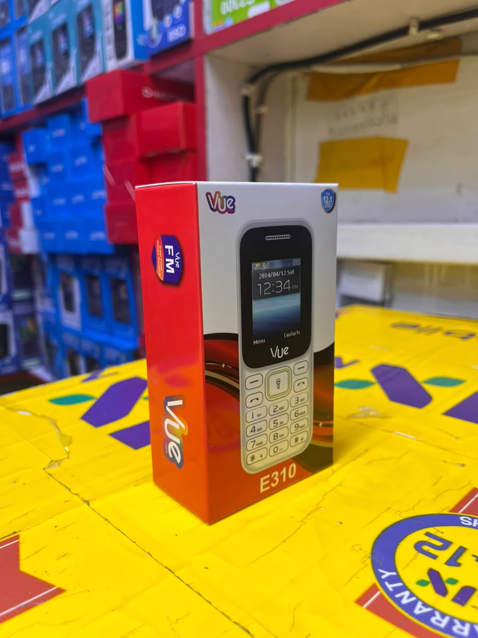VUE E310 IS AN AFFORDABLE DUAL-SIM FEATURE PHONE FEATURING A 1.77-INCH SCREEN, A WIRELESS FM RADIO, AND A BUILT-IN TORCH LIGHT (OFTEN STYLED LOCALLY AS A "MULIKA MWIZI" OR "KABAMBE" PHONE