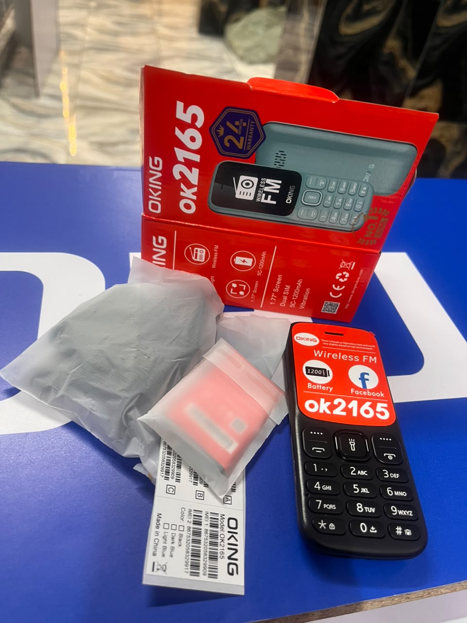 OKING OK 2165 FEATURED KABAMBE MOBILE PHONE WITH DUAL SIM CARD, LOUD SPEAKER, FACEBOOK, VIBRATION, ALARM, HD CAMERA, CALCULATOR, POWERFUL BATTERY, WIRELESS FM & BIG TORCH RELIABLE MOBILE PHONE DESIGN